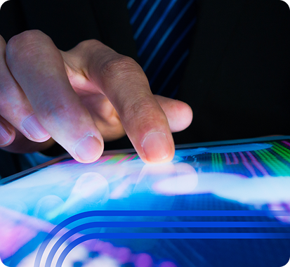 Close-up of a person&#39;s hand interacting with a glowing touchscreen tablet displaying colorful data charts and digital analytics.